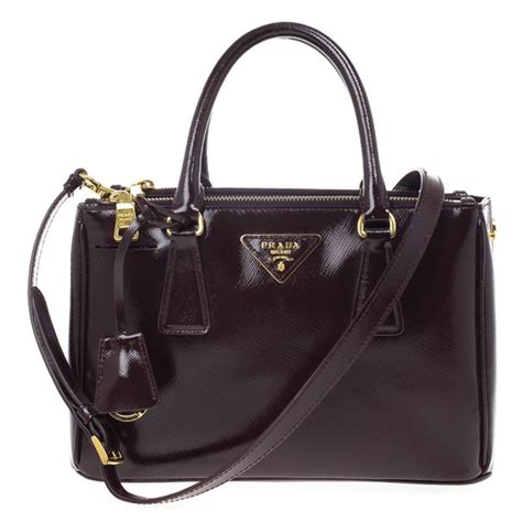 prada handbags black and maroon|Prada black saffiano bag.